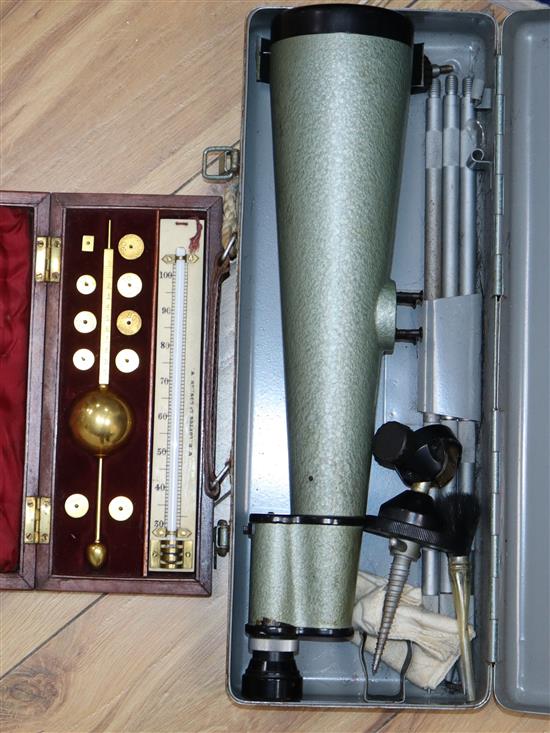 A cased Sykes hydrometer and a cased spotting scope